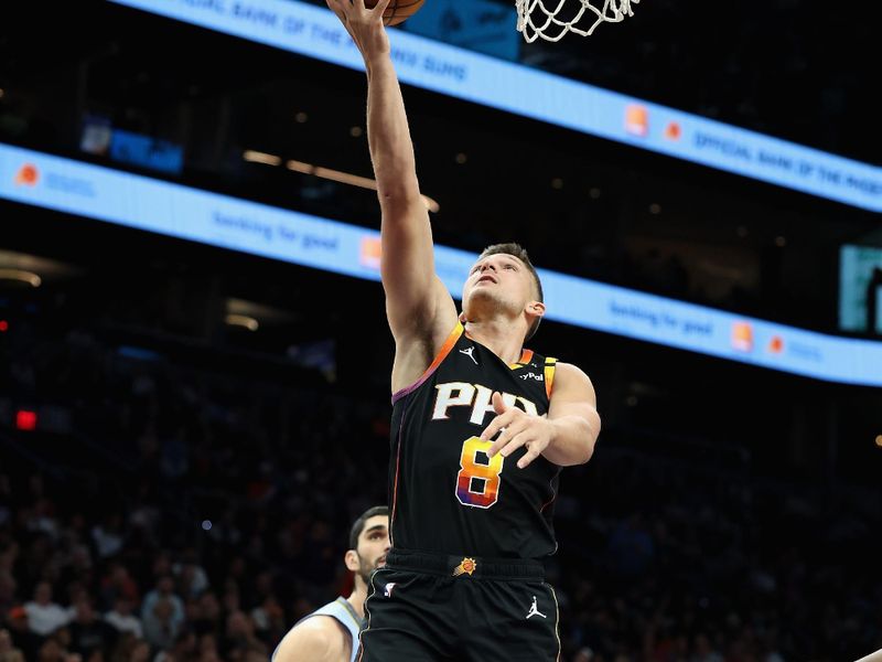 PHOENIX, ARIZONA - FEBRUARY 11: Grayson Allen #8 of the Phoenix Suns lays up a shot against the Memphis Grizzlies during the first half of the NBA game at Footprint Center on February 11, 2025 in Phoenix, Arizona.  NOTE TO USER: User expressly acknowledges and agrees that, by downloading and or using this photograph, User is consenting to the terms and conditions of the Getty Images License Agreement.  (Photo by Christian Petersen/Getty Images)