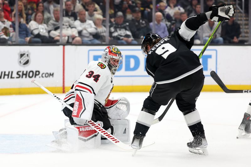 Mar 19, 2024; Los Angeles, California, USA;  Chicago Blackhawks goaltender Petr Mrazek (34) defends the goal against Los Angeles Kings right wing Adrian Kempe (9) during the first period at Crypto.com Arena. Mandatory Credit: Kiyoshi Mio-USA TODAY Sports