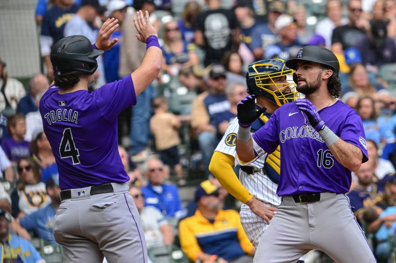 Sep 8, 2024; Milwaukee, Wisconsin, USA; Colorado Rockies center fielder Sam Hilliard (16) is greeted by first baseman Michael Toglia (4) after hitting a 3-run home run in the fifth inning against the Milwaukee Brewers at American Family Field. Mandatory Credit: Benny Sieu-Imagn Images