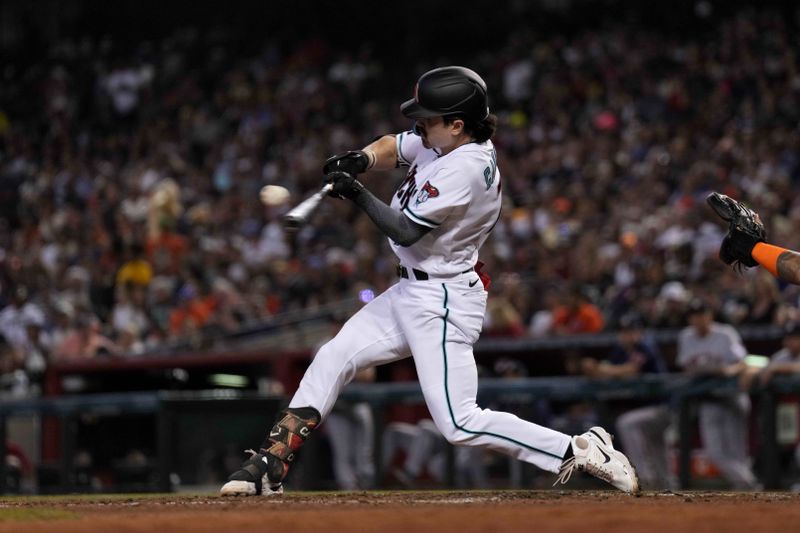 Sep 30, 2023; Phoenix, Arizona, USA; Arizona Diamondbacks right fielder Corbin Carroll (7) bats against the Houston Astros during the third inning at Chase Field. Mandatory Credit: Joe Camporeale-USA TODAY Sports