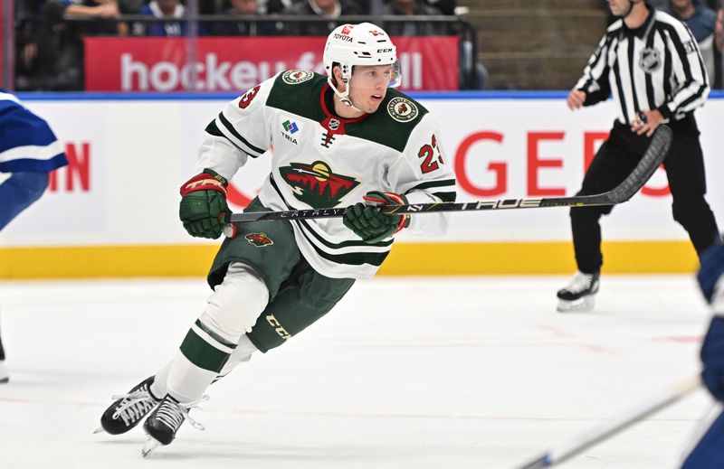 Oct 14, 2023; Toronto, Ontario, CAN;   Minnesota Wild forward Marco Rossi (23) pursues the play against the Toronto Maple Leafs in the first period at Scotiabank Arena. Mandatory Credit: Dan Hamilton-USA TODAY Sports