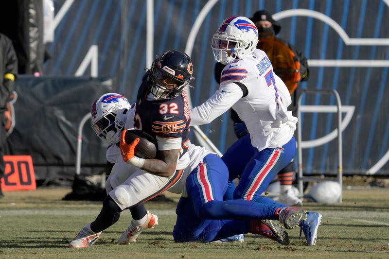 Chicago Bears running back David Montgomery (32) is tackled by Buffalo Bills defensive end Shaq Lawson (90) in the second half of an NFL football game in Chicago, Saturday, Dec. 24, 2022. (AP Photo/Nam Y. Huh)