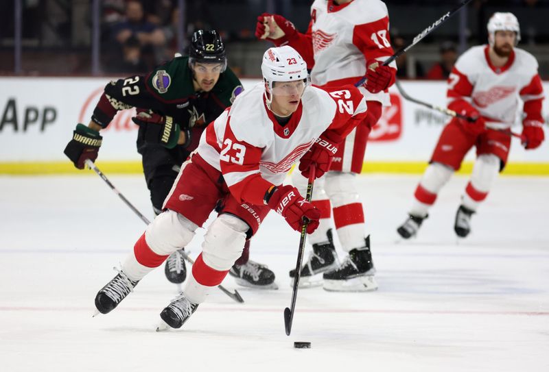 Jan 17, 2023; Tempe, Arizona, USA; Detroit Red Wings left wing Lucas Raymond (23) moves the puck against the Arizona Coyotes in the first period at Mullett Arena. Mandatory Credit: Mark J. Rebilas-USA TODAY Sports