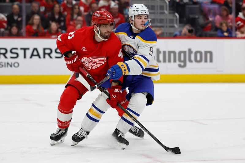 Apr 7, 2024; Detroit, Michigan, USA; Detroit Red Wings defenseman Shayne Gostisbehere (41) and Buffalo Sabres left wing Zach Benson (9) fight for position in the third period at Little Caesars Arena. Mandatory Credit: Rick Osentoski-USA TODAY Sports