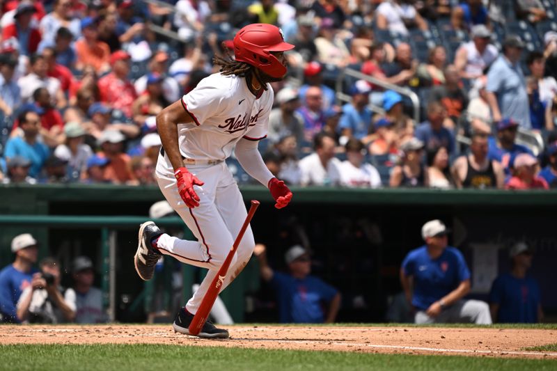 Jul 4, 2024; Washington, District of Columbia, USA; Washington Nationals center fielder James Wood (50) drops his bat on his way to first base against the New York Mets during the sixth inning at Nationals Park. Mandatory Credit: Rafael Suanes-USA TODAY Sports