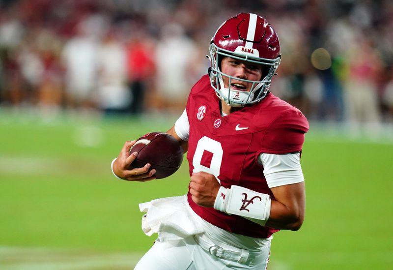 Sep 2, 2023; Tuscaloosa, Alabama, USA; Alabama Crimson Tide quarterback Tyler Buchner (8) scrambles up the field against the Middle Tennessee Blue Raiders during the second half at Bryant-Denny Stadium. Mandatory Credit: John David Mercer-USA TODAY Sports