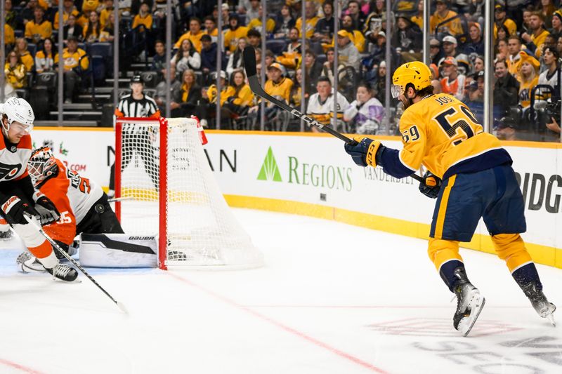 Nov 27, 2024; Nashville, Tennessee, USA;  Nashville Predators defenseman Roman Josi (59) scores off the back of Philadelphia Flyers goaltender Aleksei Kolosov (35) during the first period at Bridgestone Arena. Mandatory Credit: Steve Roberts-Imagn Images