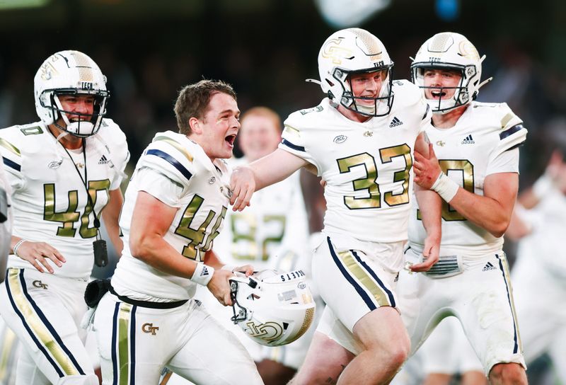 Aug 24, 2024; Dublin, IRL; Georgia Tech place kicker Aidan Birr is congratulates by teammates after scoring the winning the field goal against Florida State at Aviva Stadium. Mandatory Credit: Tom Maher/INPHO via USA TODAY Sports