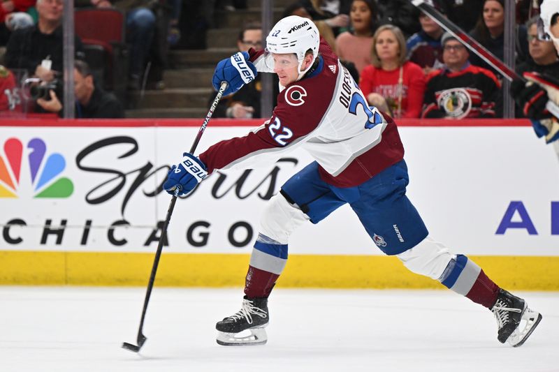 Dec 19, 2023; Chicago, Illinois, USA; Colorado Avalanche forward Fredrik Olofsson (22) shoots the puck on goal in the second period against the Chicago Blackhawks at United Center. Mandatory Credit: Jamie Sabau-USA TODAY Sports