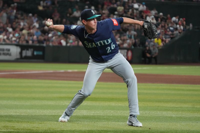 Jun 9, 2025; Phoenix, Arizona, USA; Seattle Mariners pitcher Emerson Hancock (26) makes the play for an out against the Arizona Diamondbacks in the fifth inning at Chase Field. Mandatory Credit: Rick Scuteri-Imagn Images