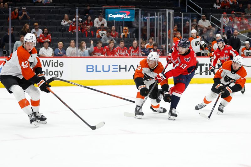 Sep 22, 2024; Washington, District of Columbia, USA; Philadelphia Flyers defenseman Adam Ginning (13) block a shot attempt by Washington Capitals forward Jakub Vrana (13) in the third period at Capital One Arena. Mandatory Credit: Geoff Burke-Imagn Images