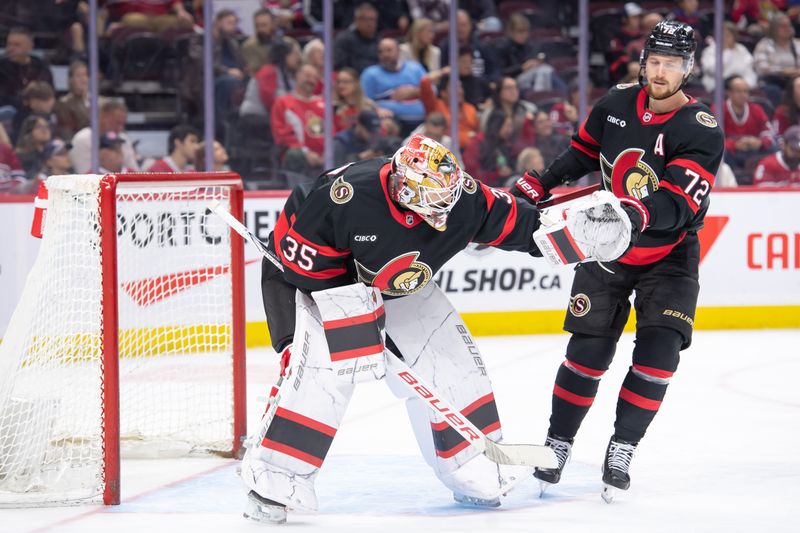 Oct 5, 2024; Ottawa, Ontario, CAN; Ottawa Senators defenseman Thomas Chabot (72) taps goalie Linus Ullmark (35) in the second period against the Montreal Canadiens at the Canadian Tire Centre. Mandatory Credit: Marc DesRosiers-Imagn Images