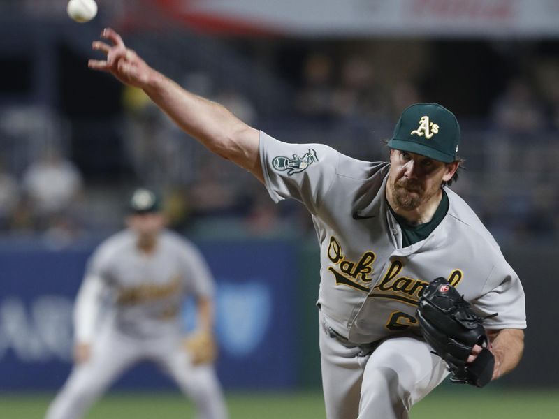 Jun 6, 2023; Pittsburgh, Pennsylvania, USA; Oakland Athletics relief pitcher Trevor May (65) pitches against the Pittsburgh Pirates during the ninth inning at PNC Park. Oakland won 11-2.  Mandatory Credit: Charles LeClaire-USA TODAY Sports