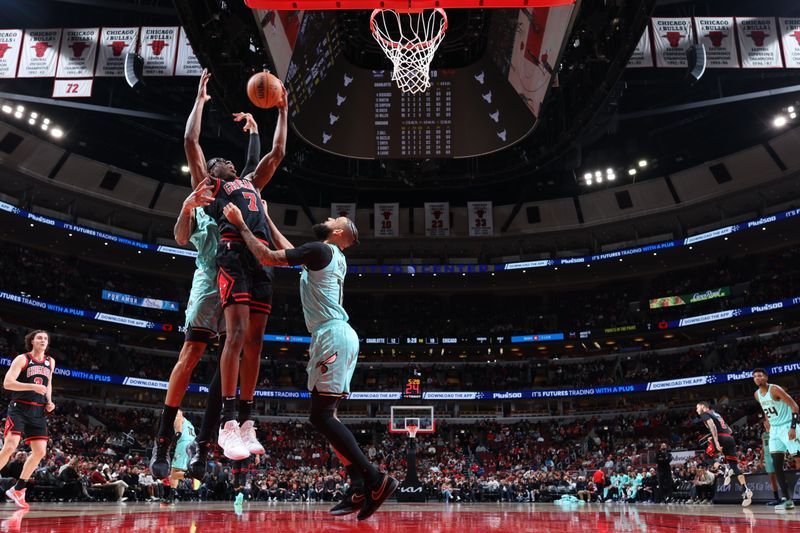 CHICAGO, IL - DECEMBER 13: Jalen Smith #7 of the Chicago Bulls goes up for the rebound during the game against the Charlotte Hornets on December 13, 2024 at United Center in Chicago, Illinois. NOTE TO USER: User expressly acknowledges and agrees that, by downloading and or using this photograph, User is consenting to the terms and conditions of the Getty Images License Agreement. Mandatory Copyright Notice: Copyright 2024 NBAE (Photo by Jeff Haynes/NBAE via Getty Images)