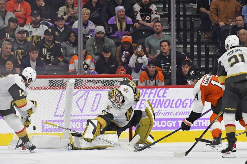 Nov 25, 2024; Philadelphia, Pennsylvania, USA; Vegas Golden Knights goaltender Ilya Samsonov (35) makes a save against Philadelphia Flyers center Sean Couturier (14) during the overtime period at Wells Fargo Center. Mandatory Credit: Eric Hartline-Imagn Images