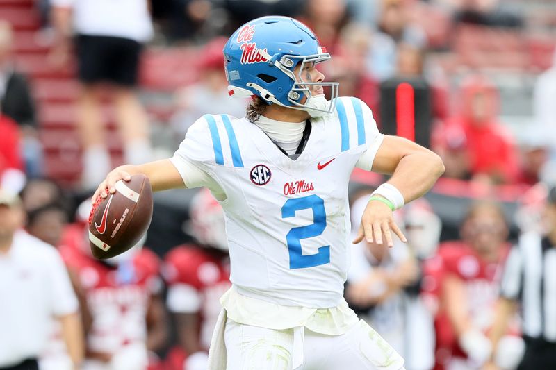 Nov 2, 2024; Fayetteville, Arkansas, USA; Ole Miss Rebels quarterback Jaxson Dart (2) passes in the fourth quarter against the Arkansas Razorbacks at Donald W. Reynolds Razorback Stadium. Mississippi won 63-31. Mandatory Credit: Nelson Chenault-Imagn Images
