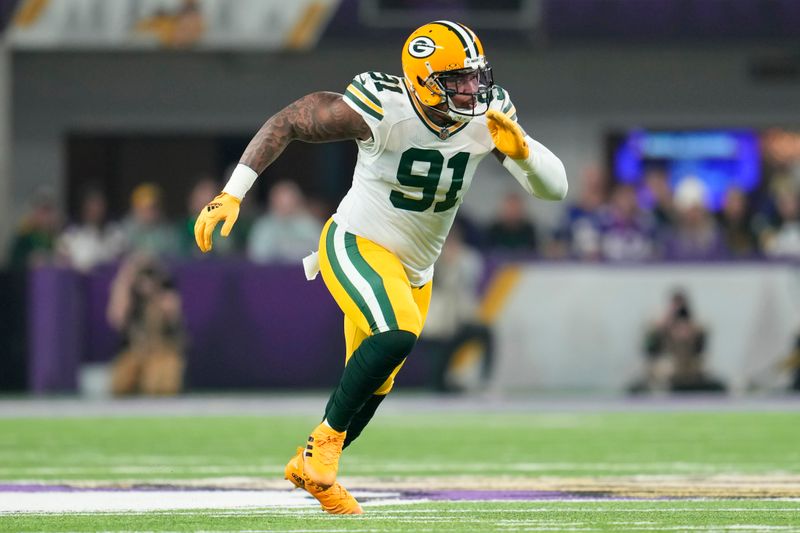 Green Bay Packers linebacker Preston Smith (91) in action during the first half of an NFL football game against the Minnesota Vikings, Sunday, Dec. 31, 2023, in Minneapolis. (AP Photo/Abbie Parr)