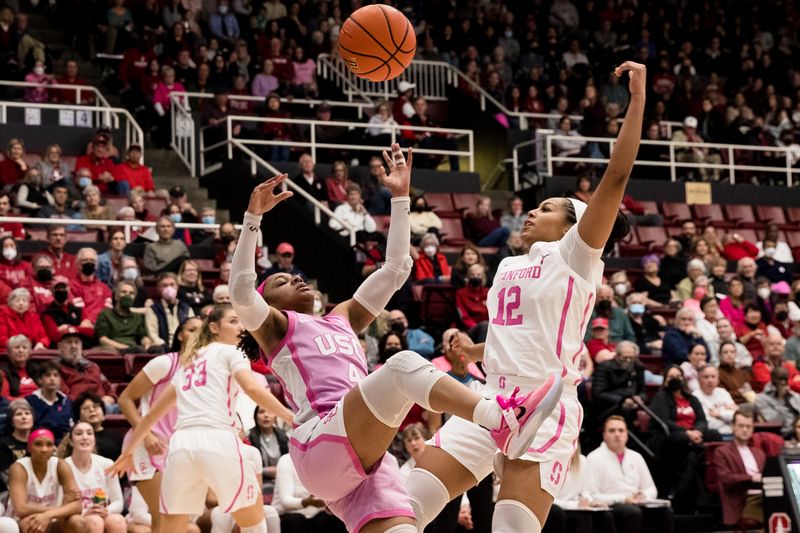 Feb 17, 2023; Stanford, California, USA;  Stanford Cardinal guard Indya Nivar (12) blocks a shot by USC Trojans guard Kayla Williams (4) during the first half at Maples Pavilion. Mandatory Credit: John Hefti-USA TODAY Sports