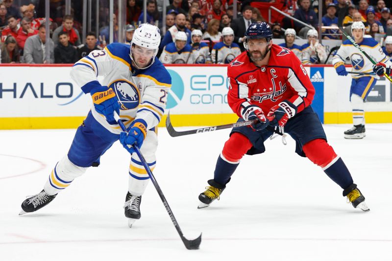 Nov 22, 2023; Washington, District of Columbia, USA; Buffalo Sabres defenseman Mattias Samuelsson (23) skates with the puck as Washington Capitals left wing Alex Ovechkin (8) defends in the third period at Capital One Arena. Mandatory Credit: Geoff Burke-USA TODAY Sports