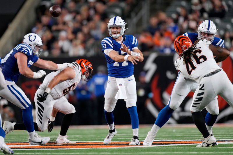 Indianapolis Colts quarterback Kedon Slovis (17) throws a pass during the second half of a preseason NFL football game against the Cincinnati Bengals, Thursday, Aug. 22, 2024, in Cincinnati. (AP Photo/Carolyn Kaster)