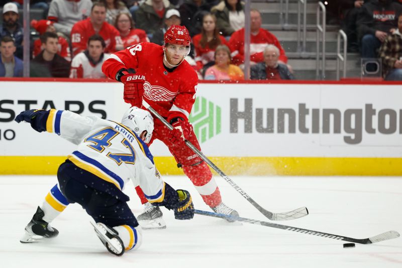 Feb 24, 2024; Detroit, Michigan, USA;  Detroit Red Wings right wing Patrick Kane (88) skates with the puck defended by St. Louis Blues defenseman Torey Krug (47) in the third period at Little Caesars Arena. Mandatory Credit: Rick Osentoski-USA TODAY Sports