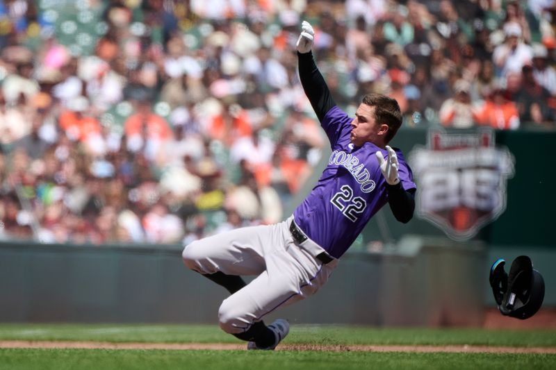 May 4, 2025; San Francisco, California, USA; Colorado Rockies outfielder Mickey Moniak (22) slides into third base with a triple against the San Francisco Giants during the fifth inning at Oracle Park. Mandatory Credit: Robert Edwards-Imagn Images