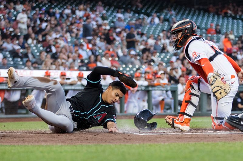 Sep 3, 2024; San Francisco, California, USA;  Arizona Diamondbacks center fielder Jorge Barrosa (1) slides home to score behind San Francisco Giants catcher Patrick Bailey (14) during the second inning at Oracle Park. Mandatory Credit: John Hefti-Imagn Images