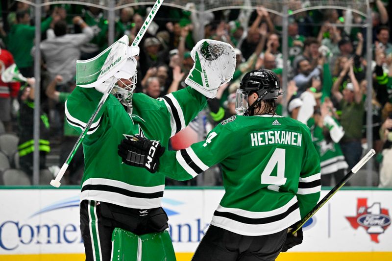 May 15, 2023; Dallas, Texas, USA; Dallas Stars goaltender Jake Oettinger (29) and defenseman Miro Heiskanen (4) celebrate after the Stars defeat the Seattle Kraken in game seven of the second round of the 2023 Stanley Cup Playoffs at the American Airlines Center. Mandatory Credit: Jerome Miron-USA TODAY Sports