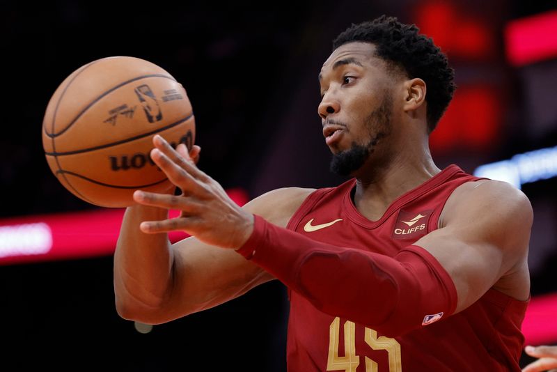 HOUSTON, TEXAS - MARCH 16: Donovan Mitchell #45 of the Cleveland Cavaliers passes the ball against the Houston Rockets during the first half at Toyota Center on March 16, 2024 in Houston, Texas. NOTE TO USER: User expressly acknowledges and agrees that, by downloading and or using this photograph, User is consenting to the terms and conditions of the Getty Images License Agreement. (Photo by Carmen Mandato/Getty Images)