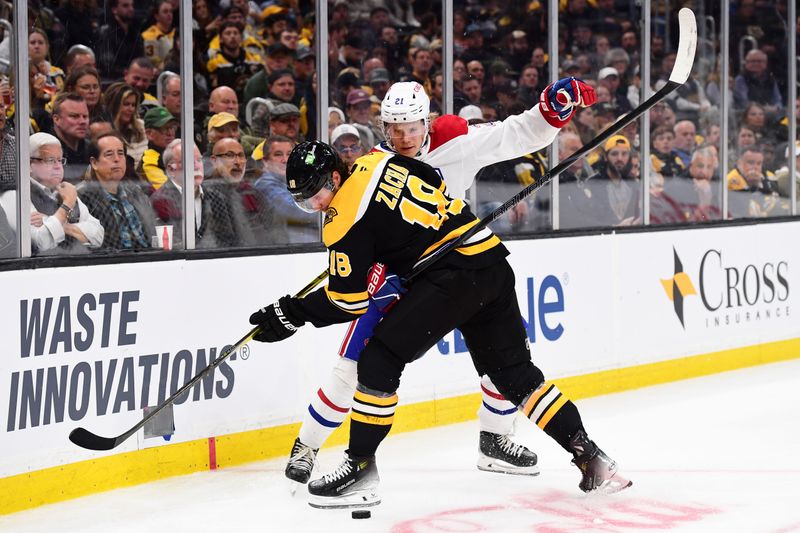 Oct 10, 2024; Boston, Massachusetts, USA; Boston Bruins center Pavel Zacha (18) and Montreal Canadiens defenseman Kaiden Guhle (21) battle for the puck during the third period at TD Garden. Mandatory Credit: Bob DeChiara-Imagn Images