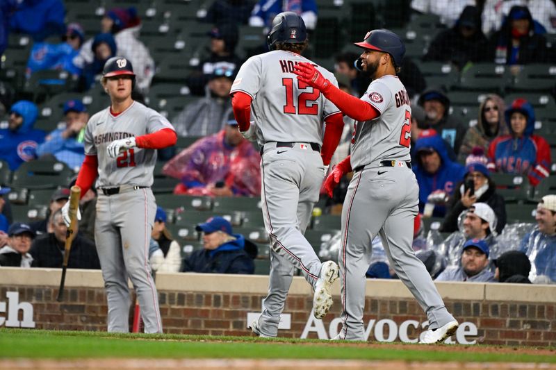 Mar 26, 2026; Chicago, Illinois, USA;  Washington Nationals third baseman Brady House (12) celebrates with second baseman Luis García Jr. (2) after a two-run home run against the Chicago Cubs during the ninth inning at Wrigley Field. Mandatory Credit: Matt Marton-Imagn Images
