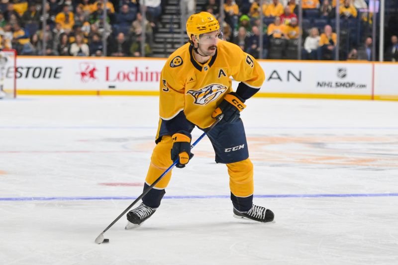 Oct 26, 2025; Nashville, Tennessee, USA;  Nashville Predators left wing Filip Forsberg (9) skates with the puck against the Dallas Stars during the first period at Bridgestone Arena. Mandatory Credit: Steve Roberts-Imagn Images