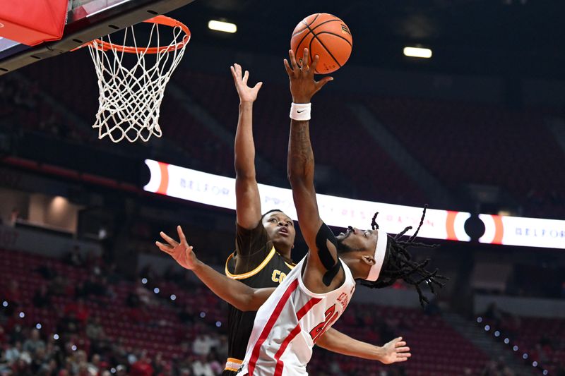 Feb 3, 2024; Las Vegas, Nevada, USA; UNLV Rebels forward Keylan Boone (20) tries to score on Wyoming Cowboys forward Cam Manyawu (5) in the first half at Thomas & Mack Center. Mandatory Credit: Candice Ward-USA TODAY Sports