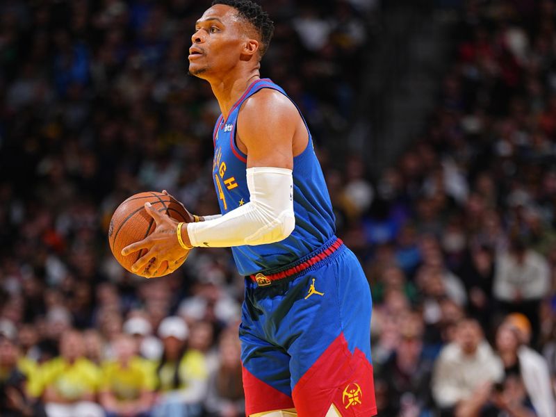 DENVER, CO - NOVEMBER 22: Russell Westbrook #4 of the Denver Nuggets looks to pass the ball during the game against the Dallas Mavericks during the Emirates NBA Cup game on November 22, 2024 at Ball Arena in Denver, Colorado. NOTE TO USER: User expressly acknowledges and agrees that, by downloading and/or using this Photograph, user is consenting to the terms and conditions of the Getty Images License Agreement. Mandatory Copyright Notice: Copyright 2024 NBAE (Photo by Garrett Ellwood/NBAE via Getty Images)