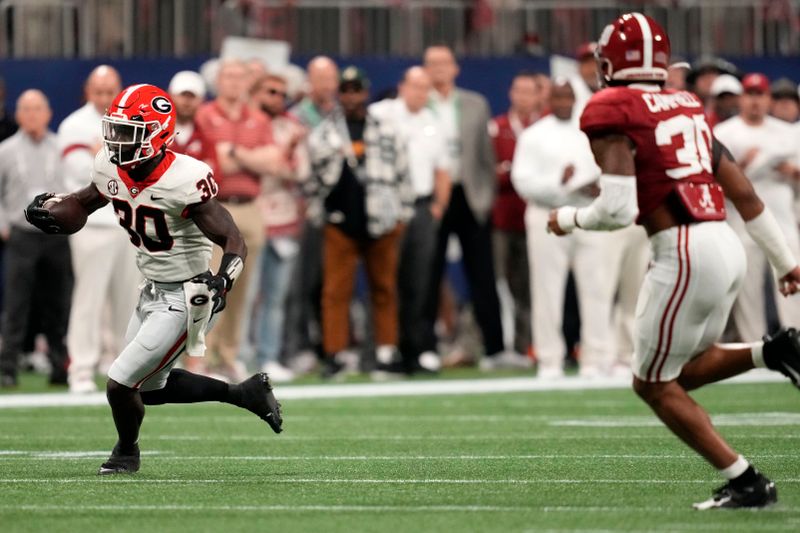 Dec 2, 2023; Atlanta, GA, USA; Georgia Bulldogs running back Daijun Edwards (30) rushes the ball against the Alabama Crimson Tide during the first half in the SEC Championship game at Mercedes-Benz Stadium. Mandatory Credit: Dale Zanine-USA TODAY Sports