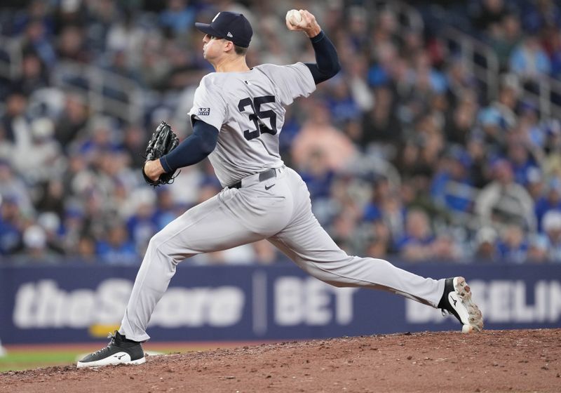 Apr 17, 2024; Toronto, Ontario, CAN; New York Yankees relief pitcher Clay Holmes (35) throws a pitch against the Toronto Blue Jays during the ninth inning at Rogers Centre. Mandatory Credit: Nick Turchiaro-USA TODAY Sports