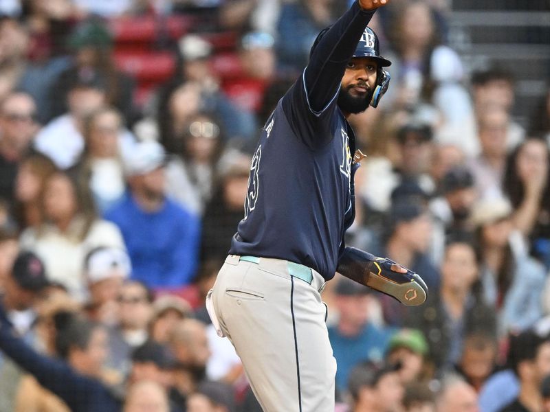 Sep 28, 2024; Boston, Massachusetts, USA; Tampa Bay Rays shortstop Junior Caminero (13) reacts after scoring a run against the Boston Red Sox during the fifth inning at Fenway Park. Mandatory Credit: Brian Fluharty-Imagn Images