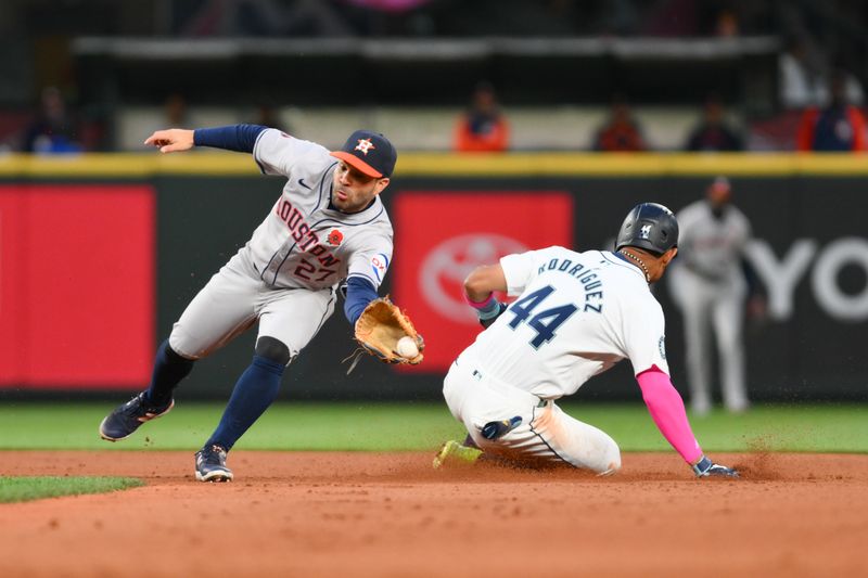 May 27, 2024; Seattle, Washington, USA; Seattle Mariners center fielder Julio Rodriguez (44) steals second base past Houston Astros second baseman Jose Altuve (27) during the seventh inning at T-Mobile Park. Mandatory Credit: Steven Bisig-USA TODAY Sports