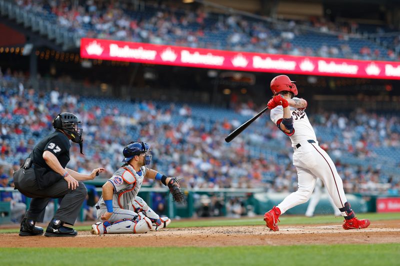 Jun 3, 2024; Washington, District of Columbia, USA; Washington Nationals outfielder Jesse Winker (6) hits an RBI single against the New York Mets during the second inning at Nationals Park. Mandatory Credit: Geoff Burke-USA TODAY Sports