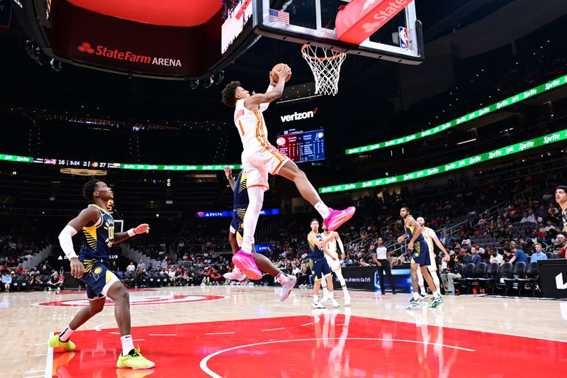 ATLANTA, GA - OCTOBER 8: Jalen Johnson #1 of the Atlanta Hawks dunks the ball during the game against the Indiana Pacers during a NBA preseason game on October 8, 2024 at State Farm Arena in Atlanta, Georgia.  NOTE TO USER: User expressly acknowledges and agrees that, by downloading and/or using this Photograph, user is consenting to the terms and conditions of the Getty Images License Agreement. Mandatory Copyright Notice: Copyright 2024 NBAE (Photo by Adam Hagy/NBAE via Getty Images)