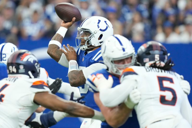 Indianapolis Colts quarterback Anthony Richardson (5) passes against the Denver Broncos during the first quarter of a preseason NFL football game, Sunday, Aug. 11, 2024, in Westfield, Ind. (AP Photo/AJ Mast)