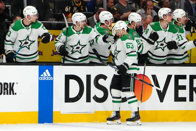 Apr 29, 2024; Las Vegas, Nevada, USA; Dallas Stars right wing Evgenii Dadonov (63) celebrates after scoring a goal against the Vegas Golden Knights during the first period of game four of the first round of the 2024 Stanley Cup Playoffs at T-Mobile Arena. Mandatory Credit: Stephen R. Sylvanie-USA TODAY Sports