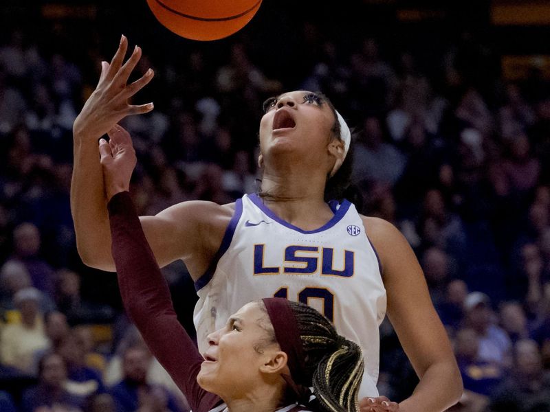 Jan 11, 2024; Baton Rouge, Louisiana, USA; LSU Lady Tigers forward Angel Reese (10) is fouled by Texas A&M Aggies guard Endyia Rogers (1) during the second half at Pete Maravich Assembly Center. Mandatory Credit: Matthew Hinton-USA TODAY Sports