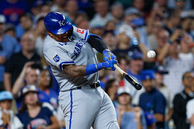 Jul 22, 2025; Chicago, Illinois, USA; Kansas City Royals first baseman Salvador Perez (13) singles against the Chicago Cubs during the ninth inning at Wrigley Field. Mandatory Credit: Kamil Krzaczynski-Imagn Images
