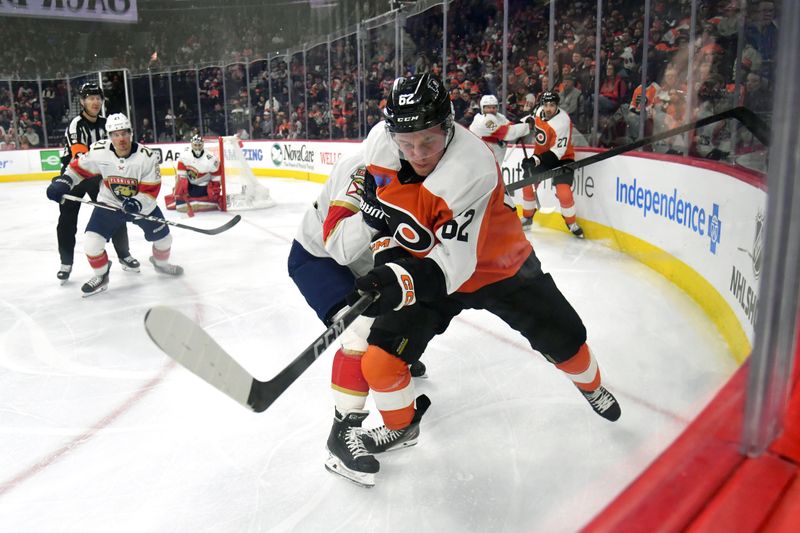 Mar 24, 2024; Philadelphia, Pennsylvania, USA; Philadelphia Flyers right wing Olle Lycksell (62) and Florida Panthers defenseman Brandon Montour (62) battle for the puck during the third period at Wells Fargo Center. Mandatory Credit: Eric Hartline-USA TODAY Sports