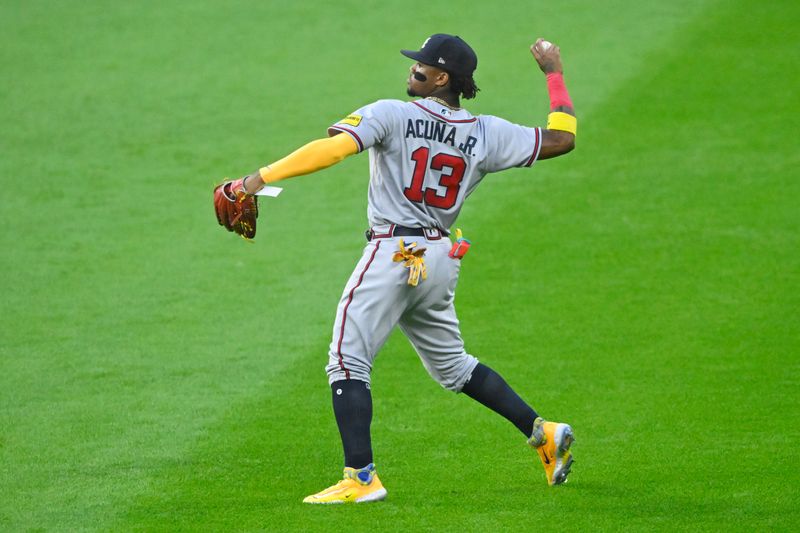 Jul 5, 2023; Cleveland, Ohio, USA; Atlanta Braves right fielder Ronald Acuna Jr. (13) throws the ball to the infield in the fifth inning against the Cleveland Guardians at Progressive Field. Mandatory Credit: David Richard-USA TODAY Sports