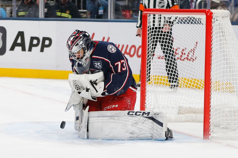 Nov 17, 2025; Columbus, Ohio, USA; Columbus Blue Jackets goalie Jet Greaves (73) makes a save against the Montreal Canadiens during the third period at Nationwide Arena. Mandatory Credit: Russell LaBounty-Imagn Images