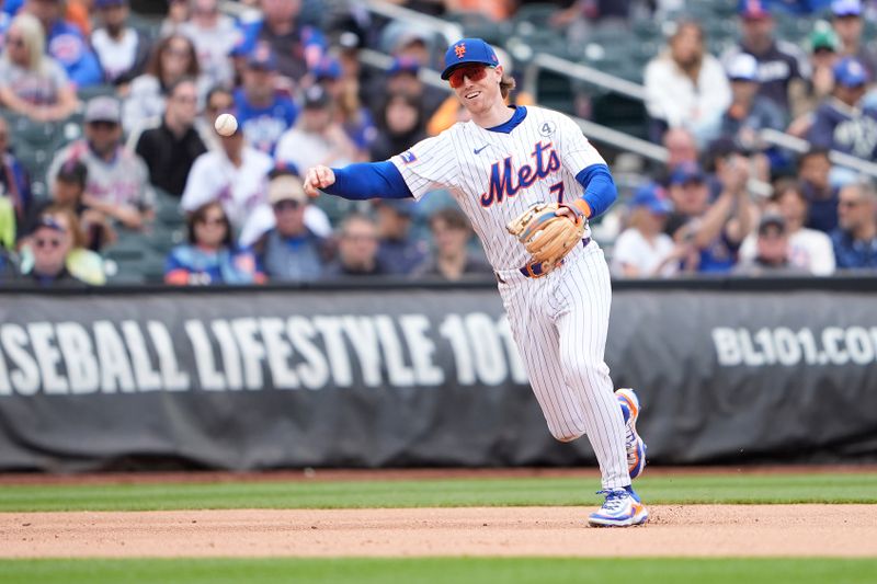 Jun 1, 2025; New York City, New York, USA; New York Mets third baseman Brett Baty (7) throws out Colorado Rockies first baseman Keston Hiura (7) (not pictured) after fielding a ground ball during the seventh inning at Citi Field. Mandatory Credit: Gregory Fisher-Imagn Images