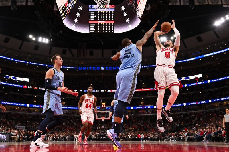 CHICAGO, ILLINOIS - APRIL 02:  Zach Lavine #8 of the Chicago Bulls shoots over Xavier Tillman Sr. #2 of the Memphis Grizzlies in the first half on April 02, 2023 at United Center in Chicago, Illinois. Chicago defeated Memphis 128-107.   NOTE TO USER: User expressly acknowledges and agrees that, by downloading and or using this photograph, User is consenting to the terms and conditions of the Getty Images License Agreement.  (Photo by Jamie Sabau/Getty Images)