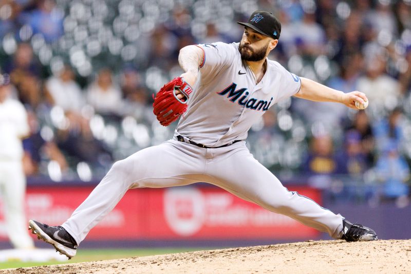 Sep 13, 2023; Milwaukee, Wisconsin, USA;  Miami Marlins pitcher Tanner Scott (66) throws a pitch during the ninth inning against the Milwaukee Brewers at American Family Field. Mandatory Credit: Jeff Hanisch-USA TODAY Sports